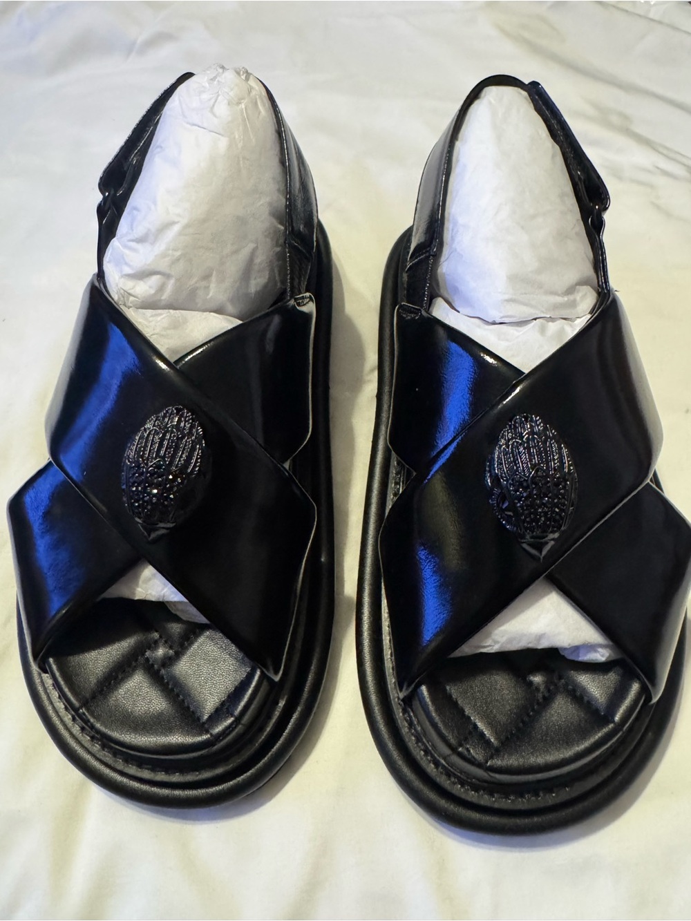 Kurk Geiger London orson platformCrisscross Sandals with Decorative Emblem